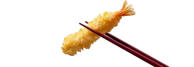 japanese tempura ebi fried held with chopsticks