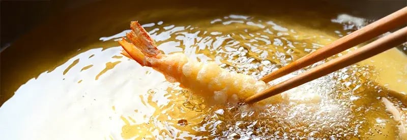 japanese tempura shrimp being fried